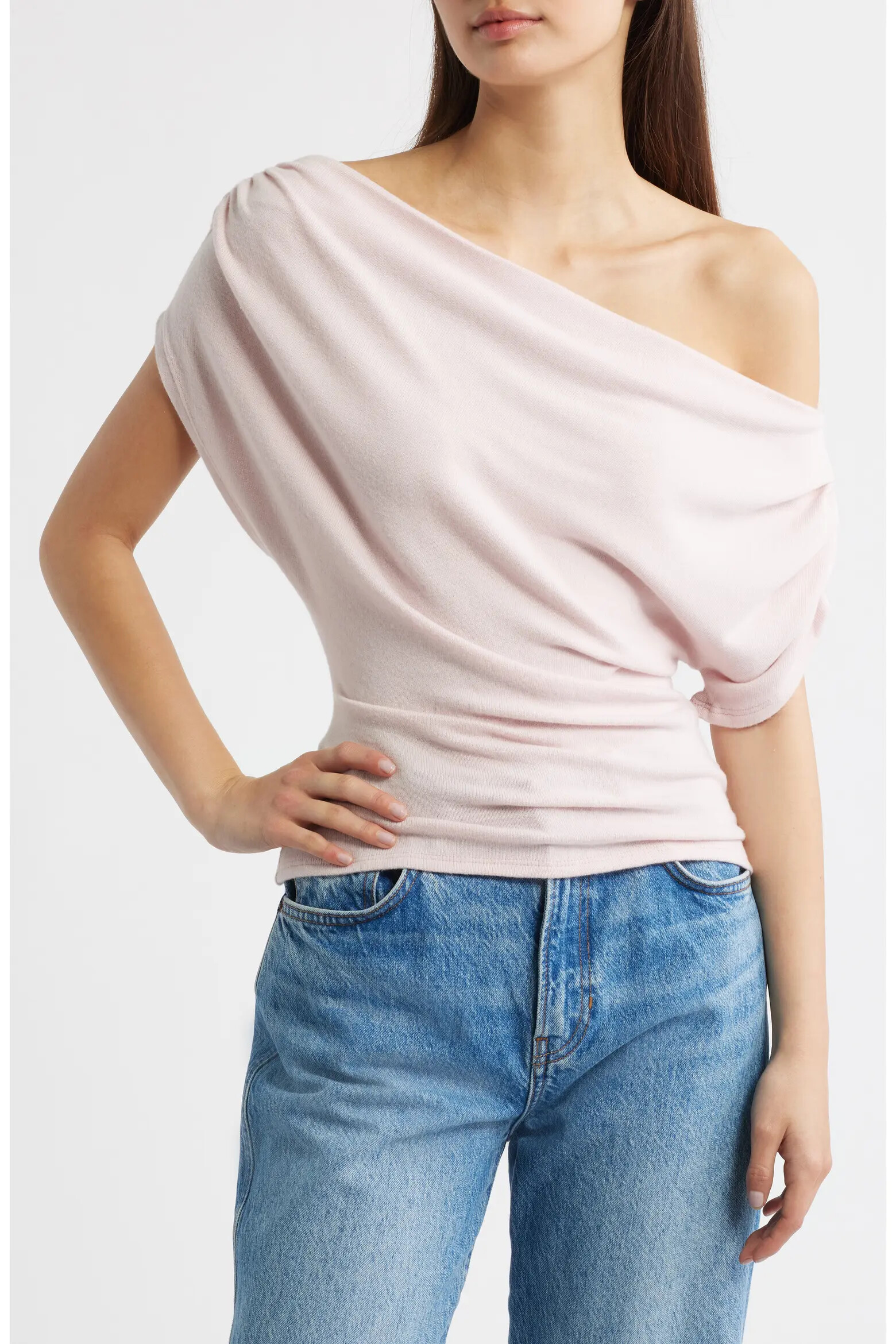 Reformation Iris one-shoulder knit top in Cherry Blossom pink worn on a model