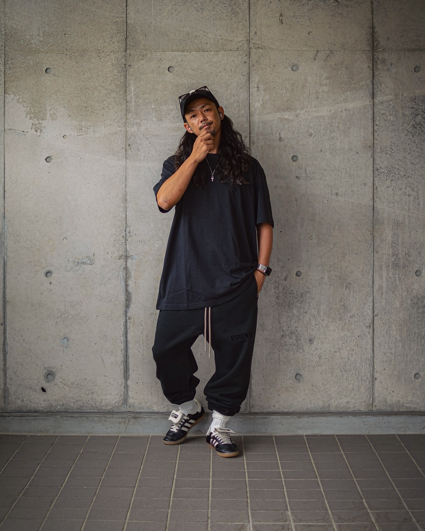 Creator wearing Wales Bonner x Adidas Pony Tonal Sambas with an oversized black T-shirt and relaxed trousers