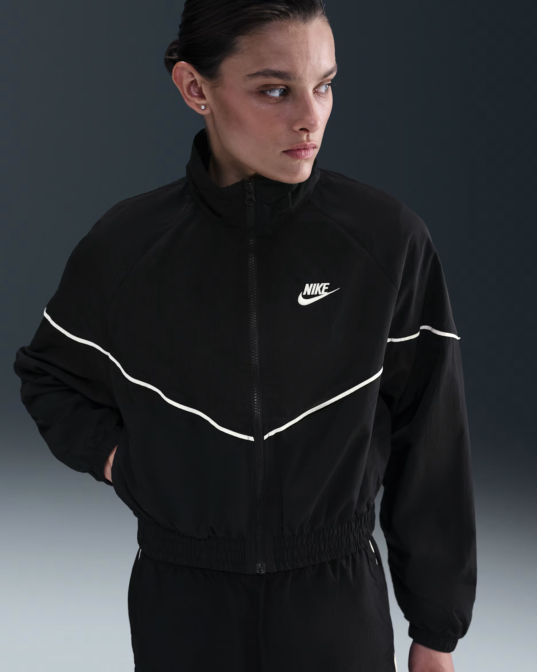 Black Nike Sportswear Windrunner women's woven jacket on a model