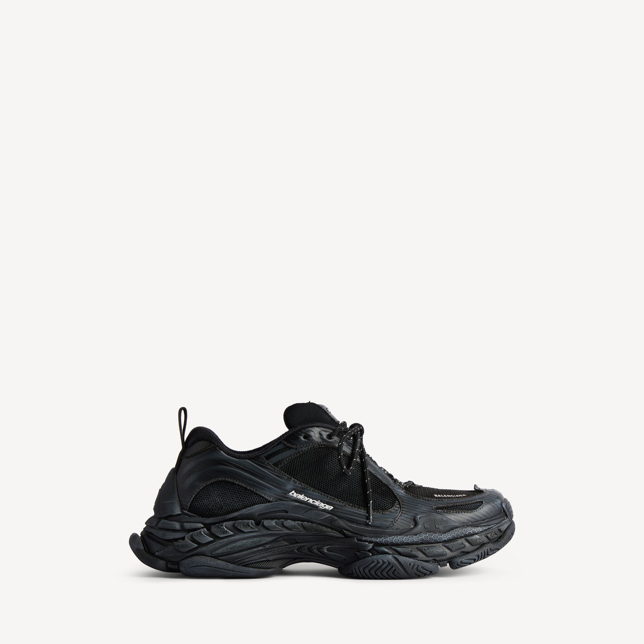 Balenciaga Triple S.2 Sneaker in black and dark grey, side view, stacked sole and tonal upper visible
