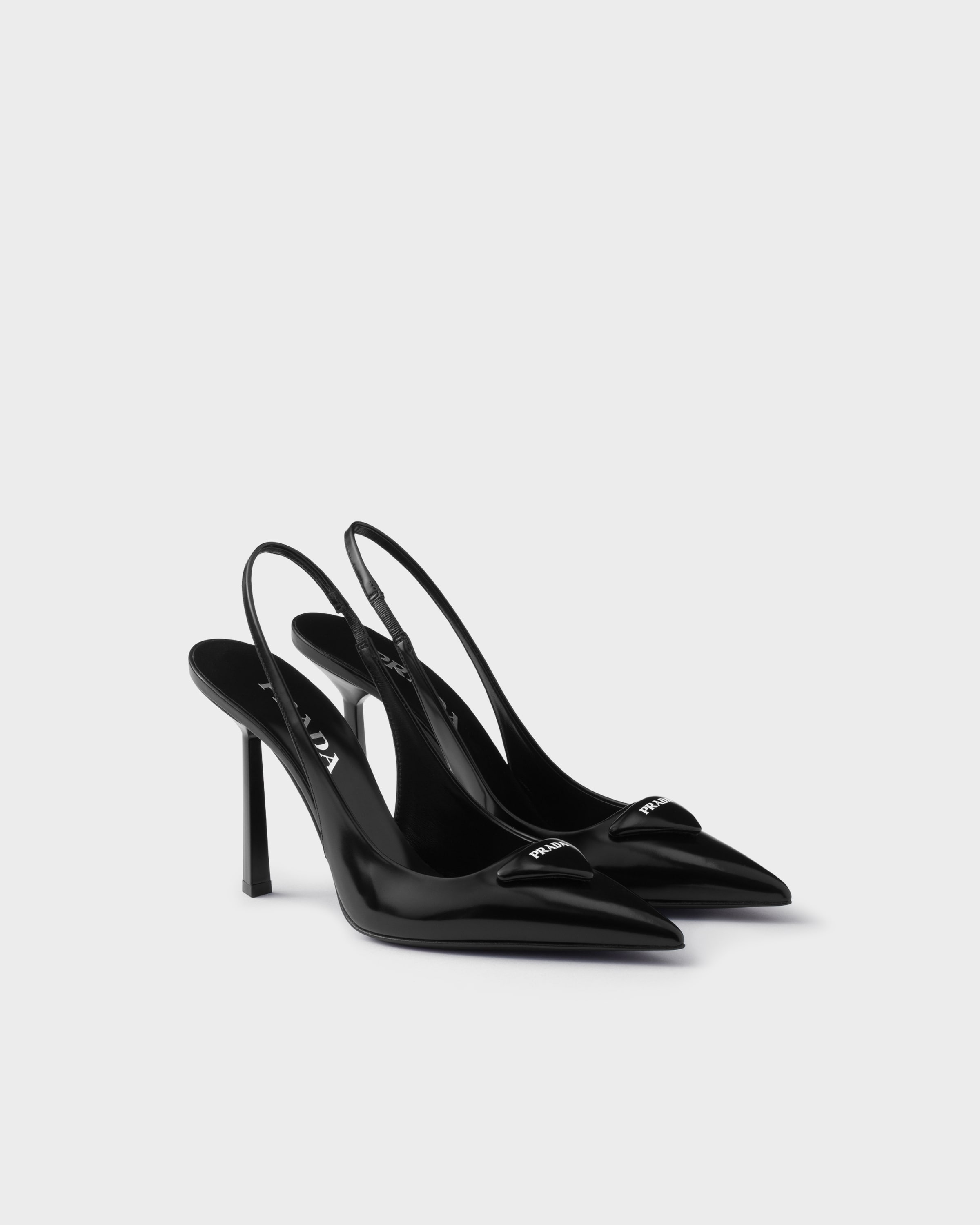 Prada Brushed leather slingback pumps in black calfskin with pointed toe and 100 mm heel
