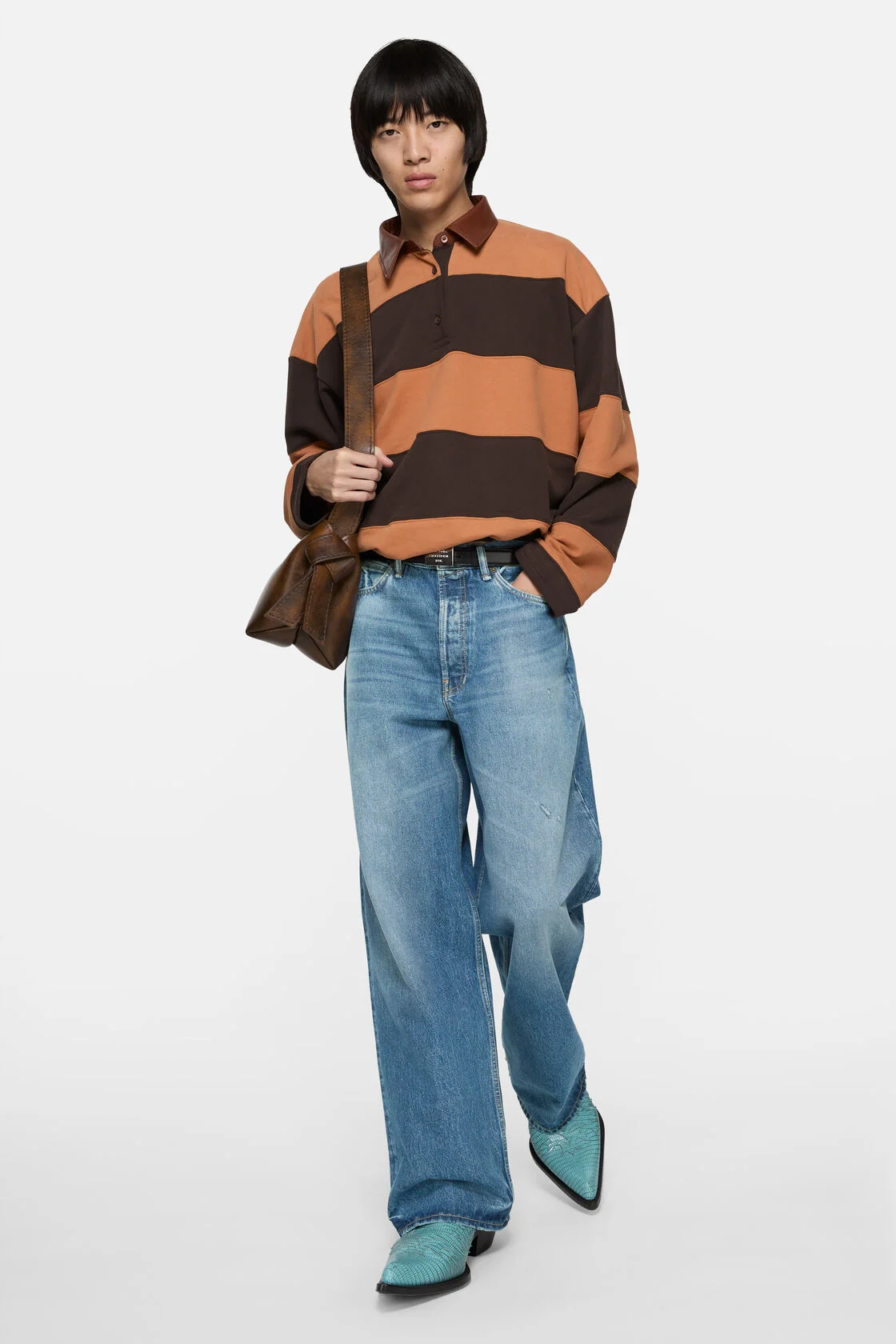 Model wearing vintage blue Acne Studios 1981 loose-fit jeans