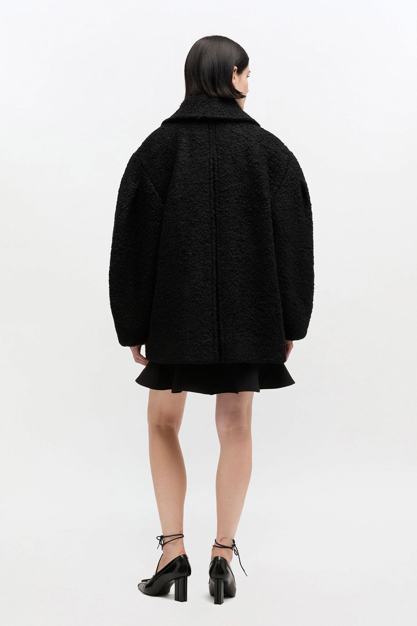 Ganni Black Boucle Midi Coat back view on model